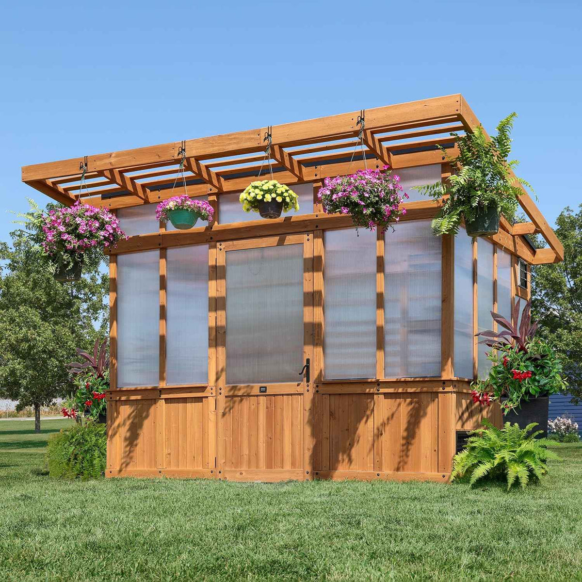 Backyard Discovery Poppy 11' x 7' Cedar Wood and Polycarbonate Walk-In Greenhouse Kit with Exhaust Fan, Windows, Hose Hook-Ups, PowerPort, Staging Shelves, Plant Hooks for Year-Round Outdoor Gardening